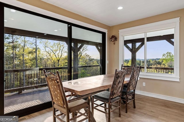 dining area with recessed lighting, wood finished floors, visible vents, and baseboards