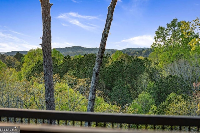 view of mountain feature with a forest view