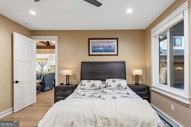 bedroom with ceiling fan, baseboards, wood finished floors, and recessed lighting