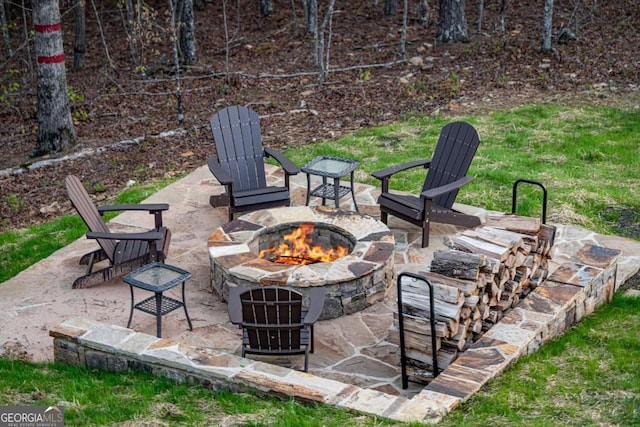 view of patio featuring an outdoor fire pit