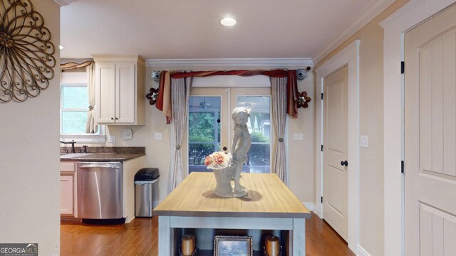 dining room with wood finished floors, a wealth of natural light, recessed lighting, and ornamental molding