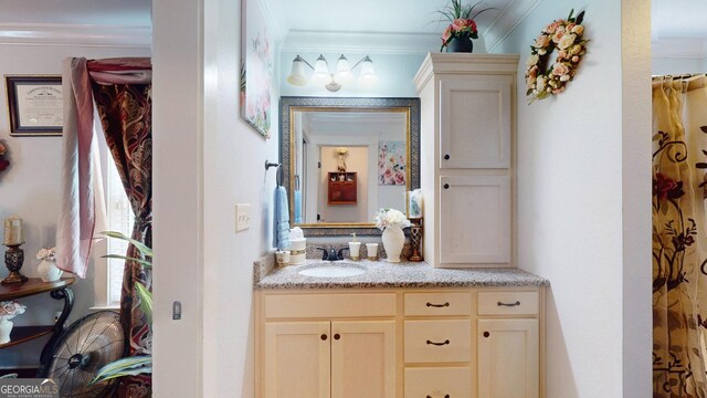 full bath featuring vanity and ornamental molding