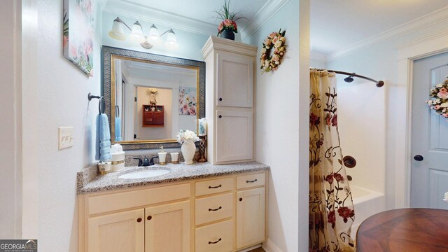 full bath featuring shower / bath combo with shower curtain, vanity, and ornamental molding
