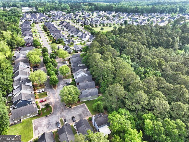 aerial view featuring a residential view and a view of trees