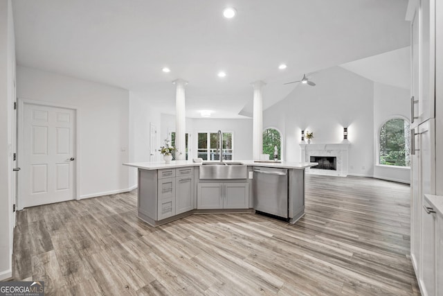 515 Old Chartwell Xing, Alpharetta, GA 30022 - kitchen with dishwasher, light countertops, open floor plan, ornate columns, and gray cabinetry
