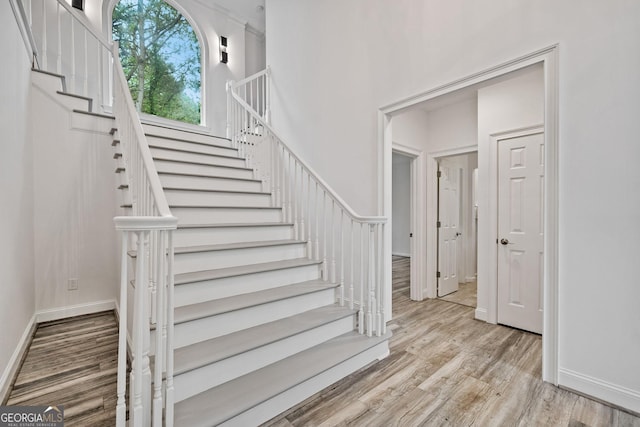515 Old Chartwell Xing, Alpharetta, GA 30022 - stairway with baseboards and wood finished floors