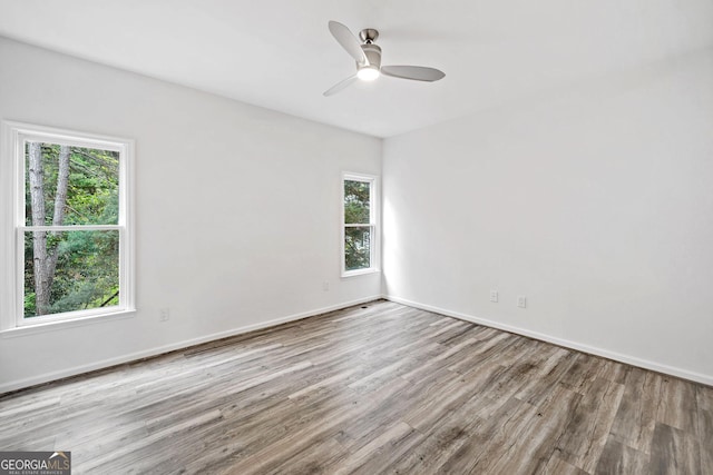 515 Old Chartwell Xing, Alpharetta, GA 30022 - empty room with baseboards, a ceiling fan, and wood finished floors