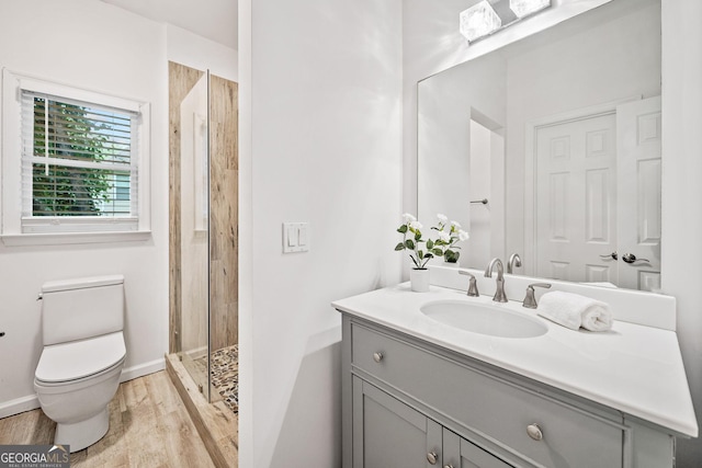 515 Old Chartwell Xing, Alpharetta, GA 30022 - bathroom with a shower stall, wood finished floors, vanity, baseboards, and toilet