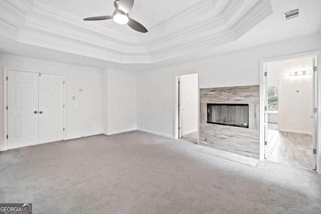 515 Old Chartwell Xing, Alpharetta, GA 30022 - unfurnished living room featuring crown molding, a raised ceiling, and visible vents
