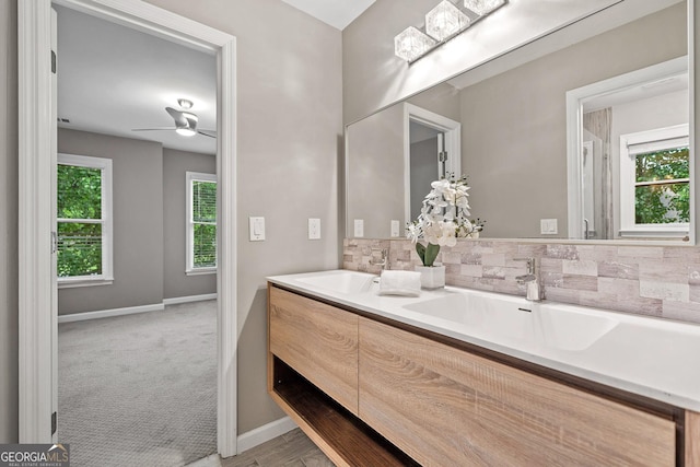 515 Old Chartwell Xing, Alpharetta, GA 30022 - bathroom featuring backsplash, baseboards, and a sink