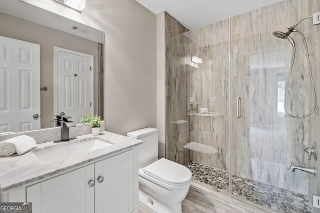515 Old Chartwell Xing, Alpharetta, GA 30022 - full bath featuring visible vents, a shower stall, toilet, and vanity