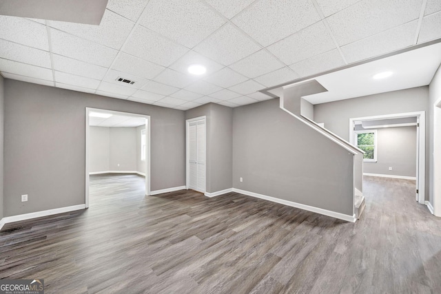 515 Old Chartwell Xing, Alpharetta, GA 30022 - basement featuring visible vents, wood finished floors, baseboards, a drop ceiling, and stairs