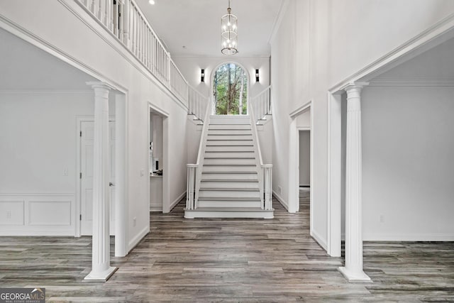 515 Old Chartwell Xing, Alpharetta, GA 30022 - foyer featuring ornamental molding, stairs, a towering ceiling, wood finished floors, and baseboards