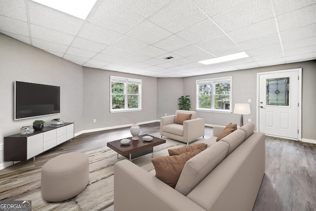 515 Old Chartwell Xing, Alpharetta, GA 30022 - living area featuring baseboards, a paneled ceiling, and wood finished floors
