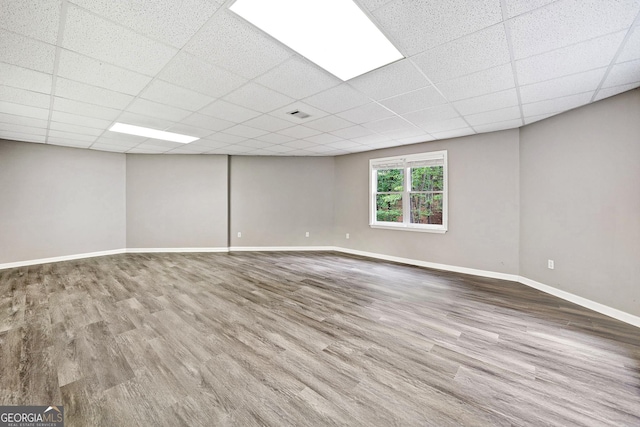515 Old Chartwell Xing, Alpharetta, GA 30022 - below grade area with wood finished floors, baseboards, a drop ceiling, and visible vents