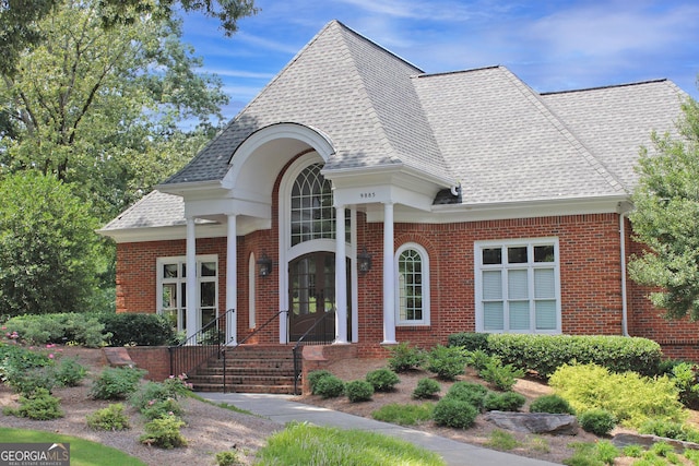 515 Old Chartwell Xing, Alpharetta, GA 30022 - view of front facade with brick siding, a shingled roof, and french doors