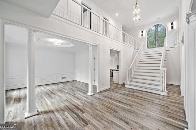 515 Old Chartwell Xing, Alpharetta, GA 30022 - basement with ornamental molding, wood finished floors, stairway, and a decorative wall