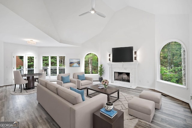 515 Old Chartwell Xing, Alpharetta, GA 30022 - living room featuring a premium fireplace, high vaulted ceiling, ceiling fan, and a wealth of natural light