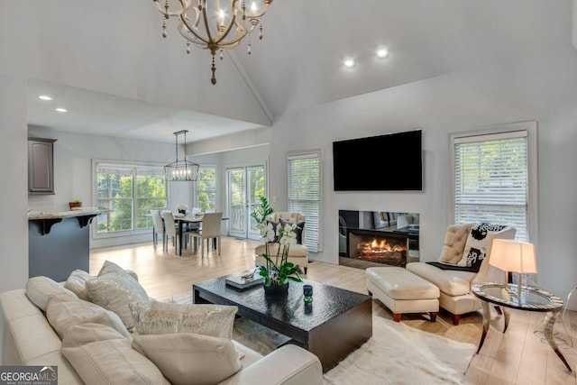 200 Piedmont Ave, Gainesville, GA 30501 - living area featuring light wood finished floors, high vaulted ceiling, a chandelier, and recessed lighting
