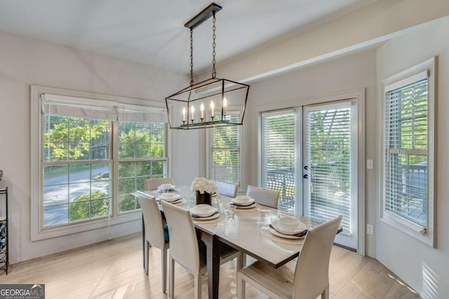200 Piedmont Ave, Gainesville, GA 30501 - dining area with light wood finished floors, plenty of natural light, french doors, and a notable chandelier