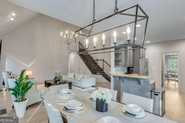 200 Piedmont Ave, Gainesville, GA 30501 - dining room with visible vents, recessed lighting, a notable chandelier, light wood-style floors, and stairs