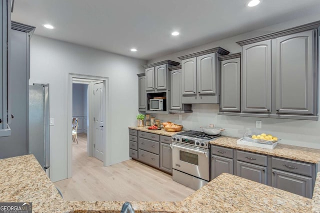 200 Piedmont Ave, Gainesville, GA 30501 - kitchen with light wood-type flooring, gray cabinets, stainless steel appliances, light stone countertops, and recessed lighting