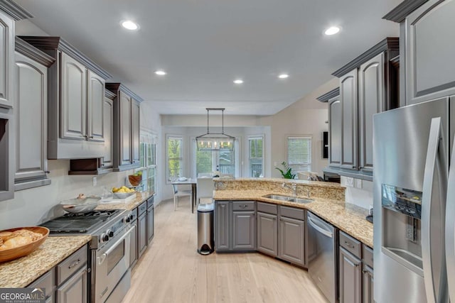 200 Piedmont Ave, Gainesville, GA 30501 - kitchen featuring stainless steel appliances, a peninsula, a sink, light wood-type flooring, and recessed lighting