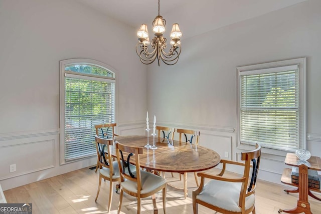 200 Piedmont Ave, Gainesville, GA 30501 - dining room with light wood-style flooring, a chandelier, and a decorative wall