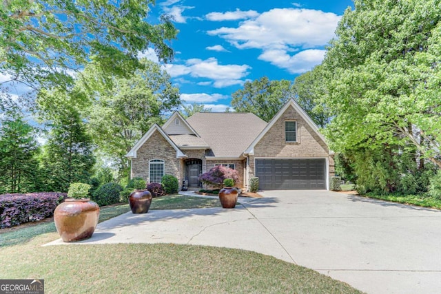 200 Piedmont Ave, Gainesville, GA 30501 - view of front facade featuring concrete driveway, stone siding, a front yard, and a garage