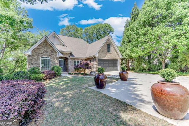 200 Piedmont Ave, Gainesville, GA 30501 - craftsman-style home featuring roof with shingles, a front lawn, stone siding, concrete driveway, and a garage