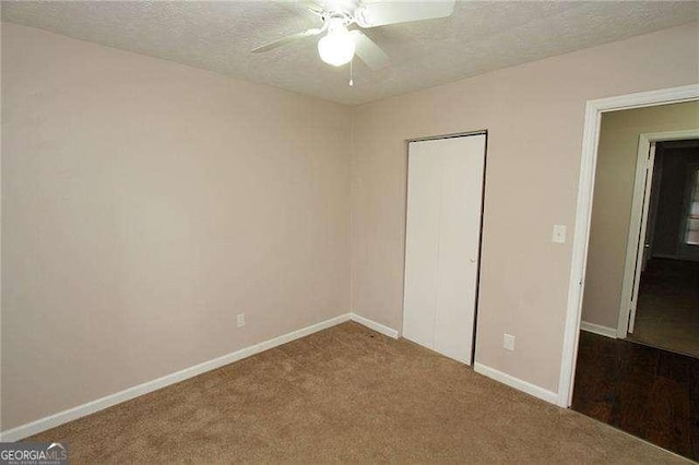 3540 Tarragon Dr, Decatur, GA 30034 - unfurnished bedroom featuring a textured ceiling, baseboards, a closet, ceiling fan, and carpet floors