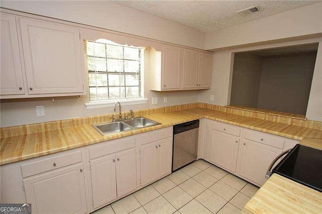 3540 Tarragon Dr, Decatur, GA 30034 - kitchen featuring white cabinets, range with electric stovetop, dishwasher, light tile patterned floors, and a sink