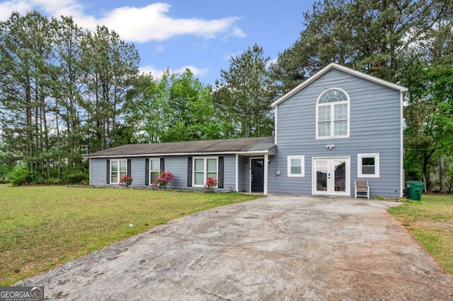 3999 Wabash Ln, Ellenwood, GA 30294 - view of front of home featuring driveway, french doors, and a front yard