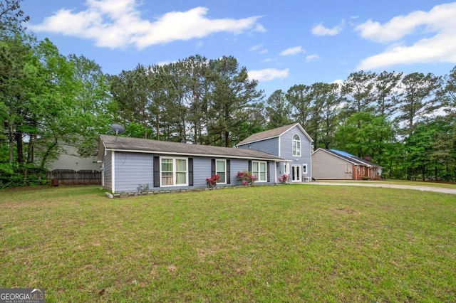 3999 Wabash Ln, Ellenwood, GA 30294 - view of front facade with driveway, a front yard, and fence