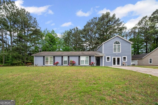 3999 Wabash Ln, Ellenwood, GA 30294 - traditional-style house with french doors, driveway, and a front yard