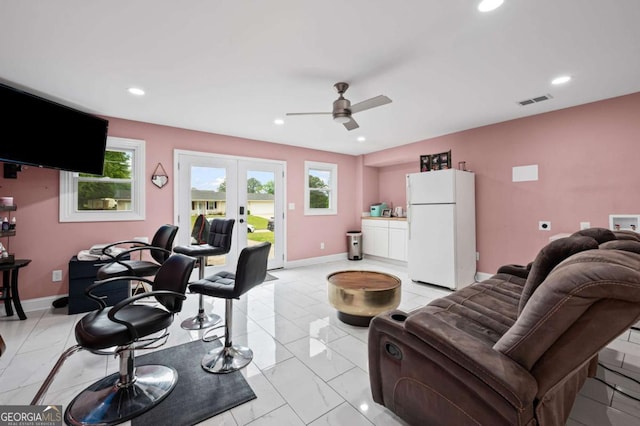 3999 Wabash Ln, Ellenwood, GA 30294 - living room with marble finish floor, a healthy amount of sunlight, french doors, and visible vents