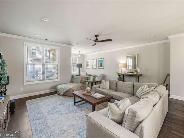 living room featuring dark wood finished floors, a ceiling fan, baseboards, and crown molding