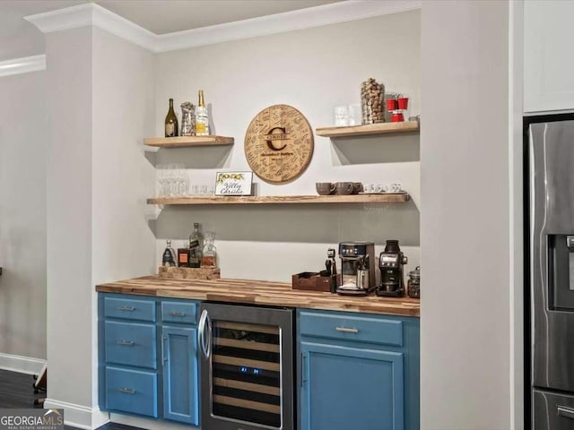bar with stainless steel fridge, bar, baseboards, ornamental molding, and wine cooler
