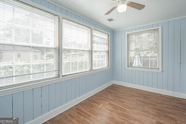 unfurnished sunroom with visible vents