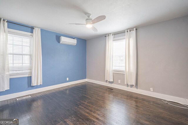 spare room with plenty of natural light, a ceiling fan, visible vents, and a wall mounted AC