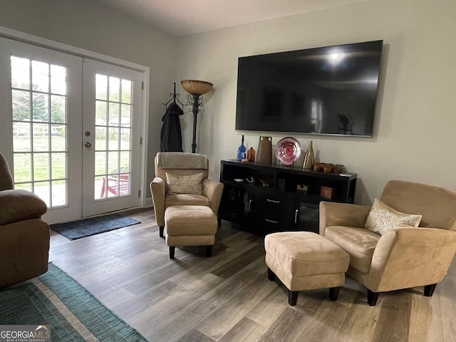 sitting room featuring french doors and wood finished floors