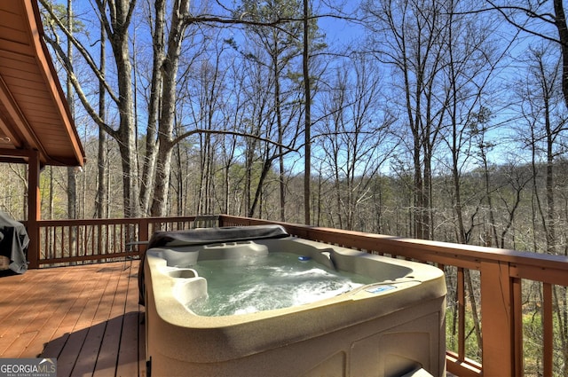 638 Cohutta Mountain Rd, Blue Ridge, GA 30513 - wooden deck featuring a hot tub and a wooded view