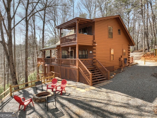638 Cohutta Mountain Rd, Blue Ridge, GA 30513 - back of house with an outdoor fire pit, a balcony, log exterior, and stairs