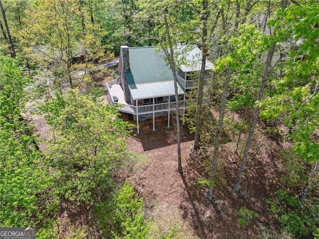 drone / aerial view featuring a view of trees