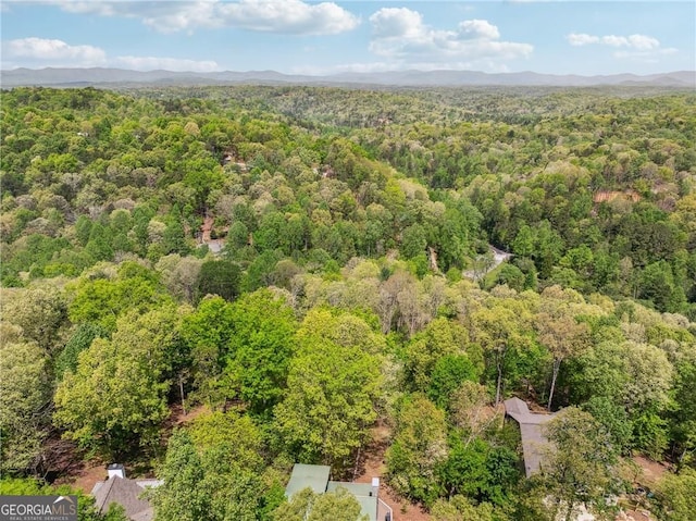 aerial view featuring a mountain view and a wooded view