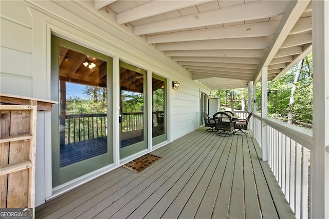 wooden terrace featuring covered porch