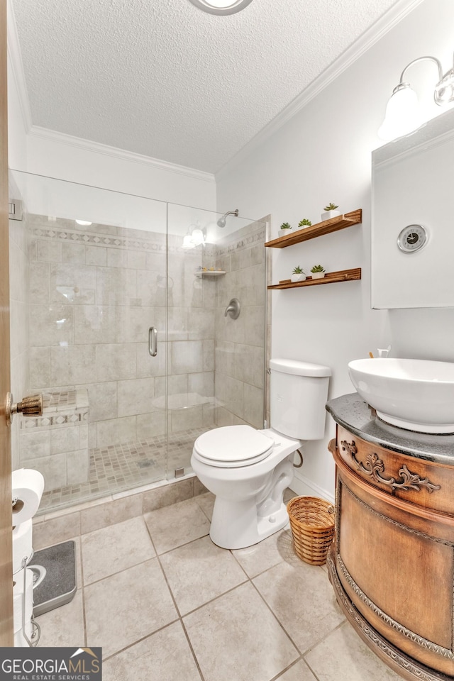 full bathroom with crown molding, a textured ceiling, and a stall shower