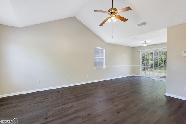 767 Madison Dr, Hinesville, GA 31313 - empty room featuring a ceiling fan, visible vents, baseboards, lofted ceiling, and dark wood-style floors