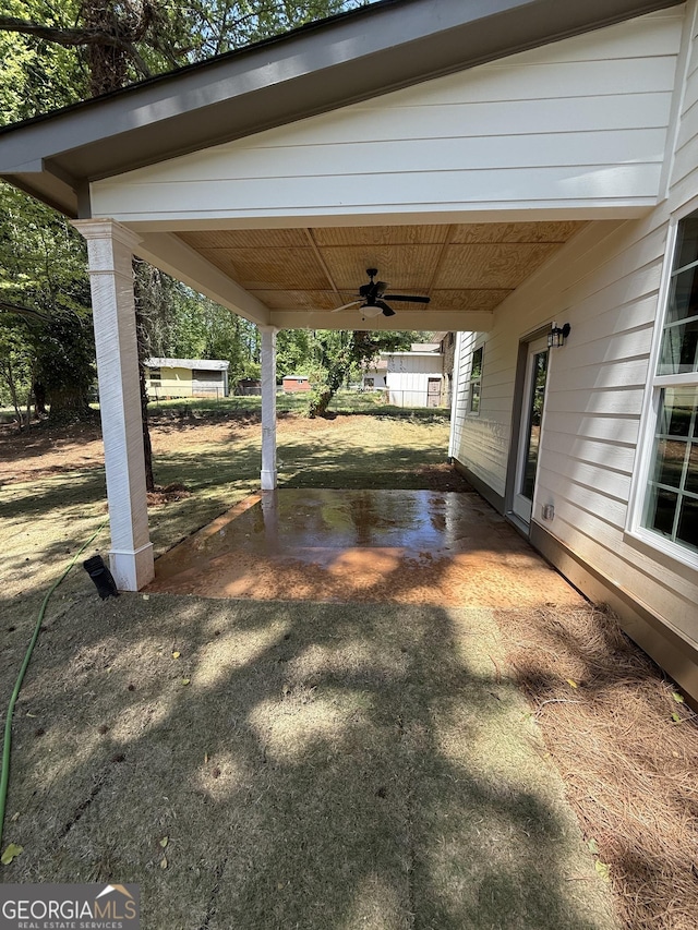 view of yard with a ceiling fan