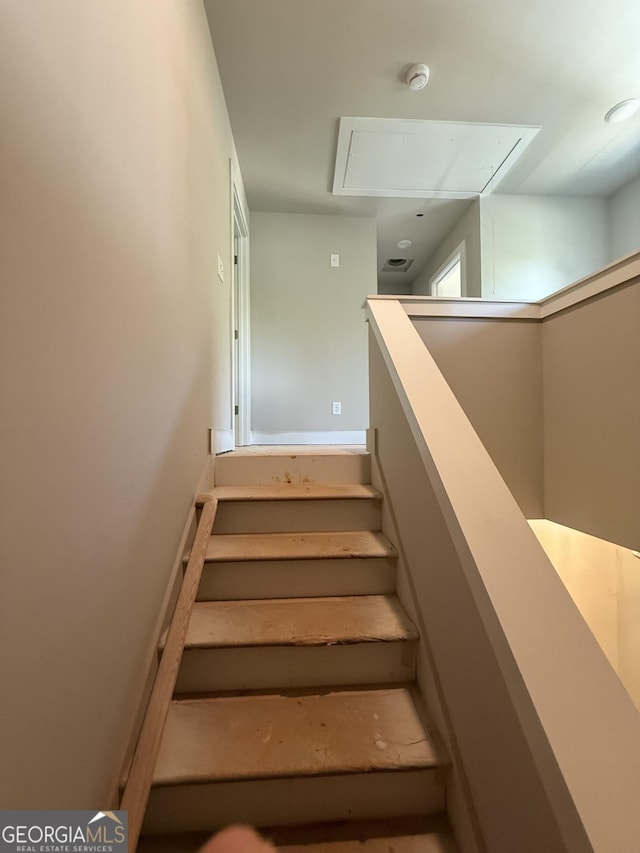 staircase with attic access